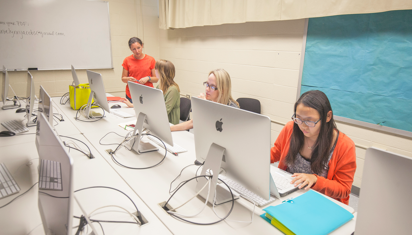 Santa Barbara City College students working on computers in School of Media Arts lab.